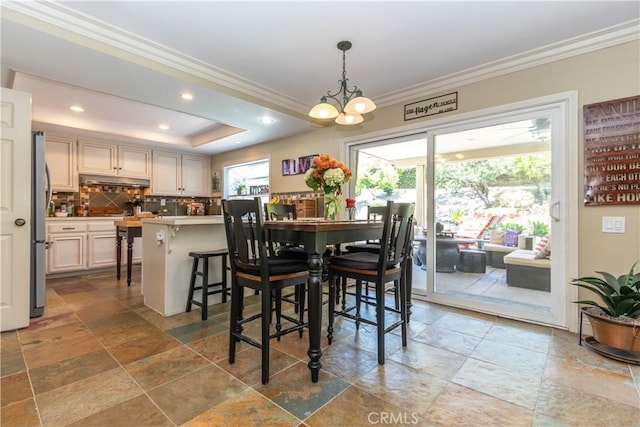 31032 Via Estenaga, San Juan Capistrano, CA 92675 - dining area with stone tile flooring, ornamental molding, recessed lighting, and a chandelier