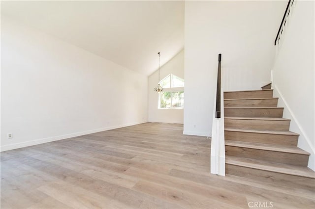 3314 Braemar Ln, Corona, CA 92882 - stairway featuring wood finished floors and high vaulted ceiling