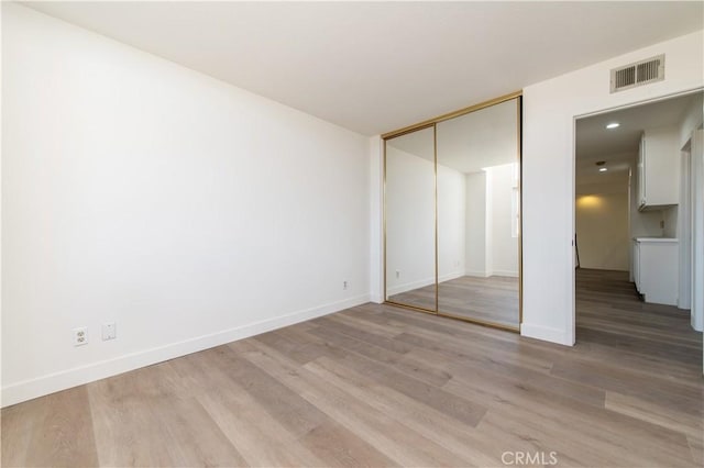 3314 Braemar Ln, Corona, CA 92882 - unfurnished bedroom with light wood-style flooring and a closet