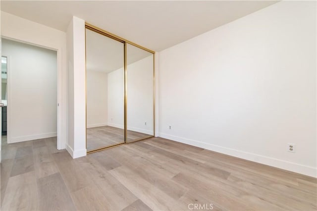3314 Braemar Ln, Corona, CA 92882 - unfurnished bedroom featuring light wood-style flooring and a closet