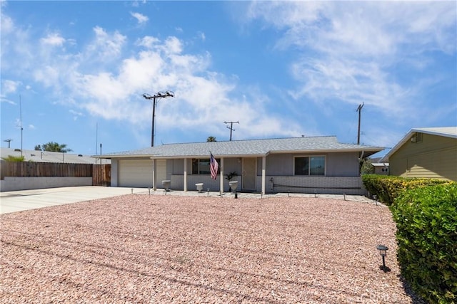 28851 Murrieta Rd, Menifee, CA 92586 - ranch-style home with driveway, an attached garage, and brick siding