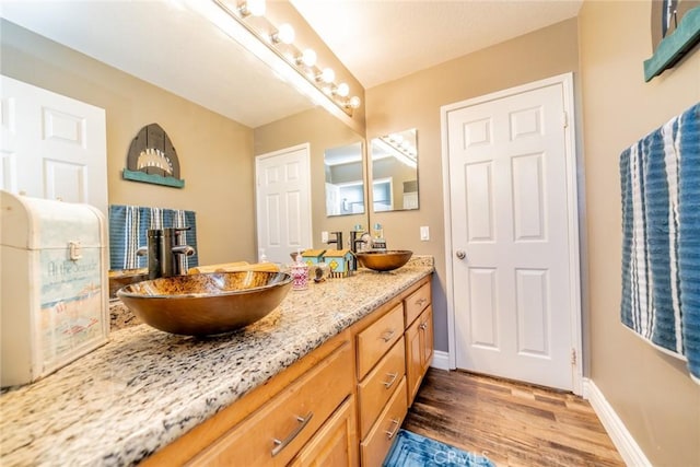 29155 Celestial Dr, Menifee, CA 92584 - bathroom with double vanity and wood finished floors