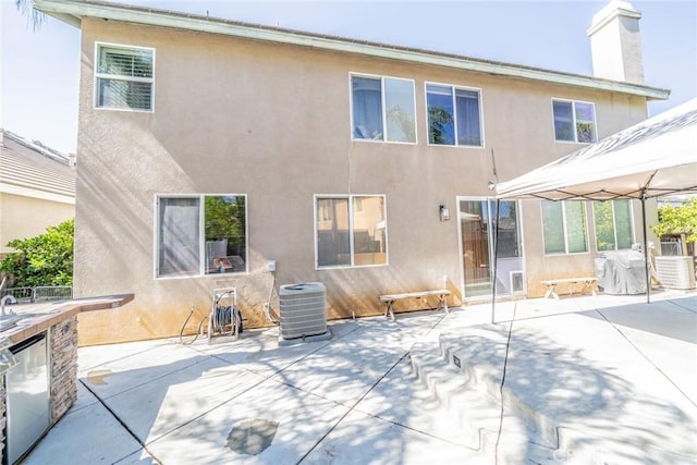 29155 Celestial Dr, Menifee, CA 92584 - rear view of property featuring a gazebo, stucco siding, a patio area, and a chimney