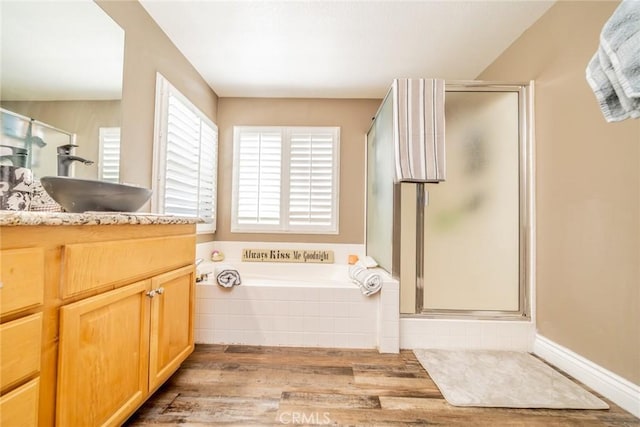 29155 Celestial Dr, Menifee, CA 92584 - bathroom featuring wood finished floors, vanity, a shower stall, and a bath