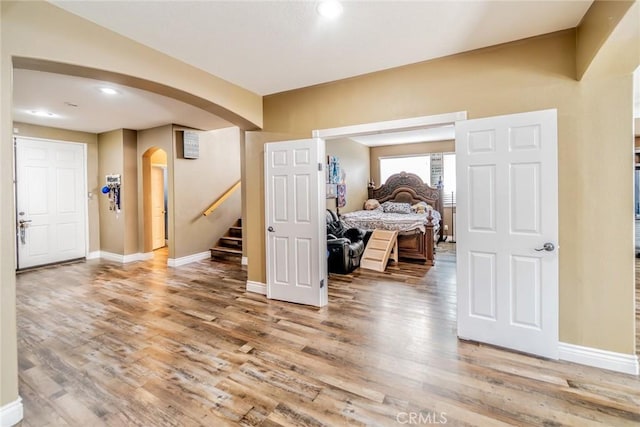 29155 Celestial Dr, Menifee, CA 92584 - interior space with arched walkways, wood finished floors, stairs, and recessed lighting