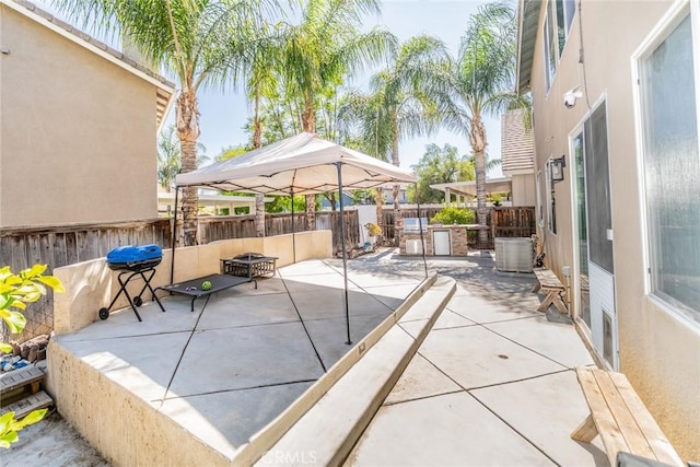 29155 Celestial Dr, Menifee, CA 92584 - fenced backyard with area for grilling, a patio, a gazebo, and an outdoor fire pit