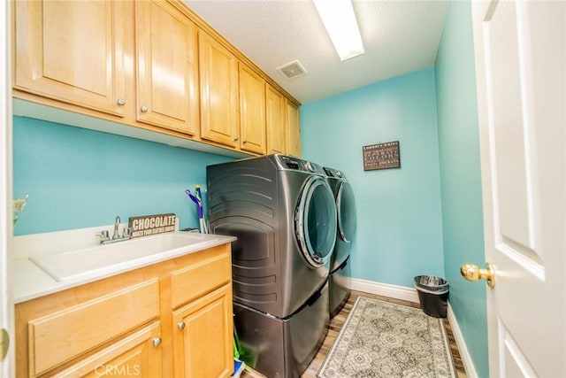29155 Celestial Dr, Menifee, CA 92584 - washroom with cabinet space, independent washer and dryer, and light wood finished floors