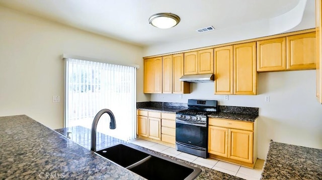 15537 Pheasant St, Chino Hills, CA 91709 - kitchen with stainless steel gas stove, under cabinet range hood, light brown cabinets, and light tile patterned floors