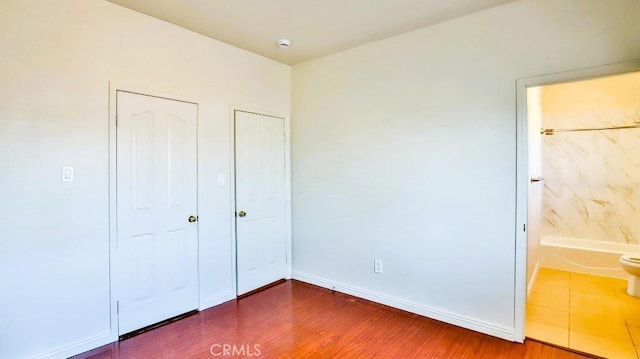 15537 Pheasant St, Chino Hills, CA 91709 - unfurnished bedroom with wood finished floors and connected bathroom