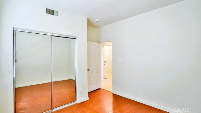 15537 Pheasant St, Chino Hills, CA 91709 - unfurnished bedroom featuring wood finished floors and a closet