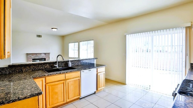 15537 Pheasant St, Chino Hills, CA 91709 - kitchen featuring white dishwasher, dark stone counters, a peninsula, and range