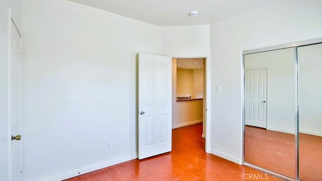15537 Pheasant St, Chino Hills, CA 91709 - unfurnished bedroom with wood finished floors and a closet