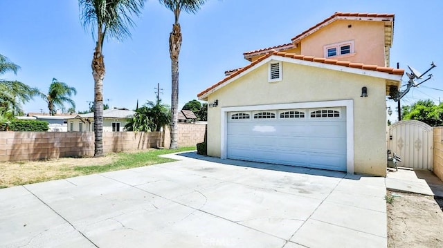 15537 Pheasant St, Chino Hills, CA 91709 - garage featuring a gate and concrete driveway
