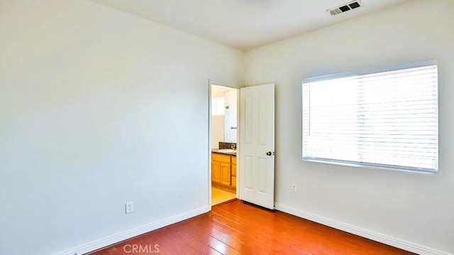 15537 Pheasant St, Chino Hills, CA 91709 - empty room with dark wood-style flooring and baseboards