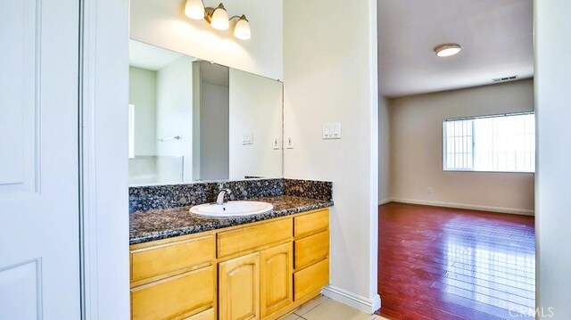 15537 Pheasant St, Chino Hills, CA 91709 - bathroom featuring vanity and wood finished floors