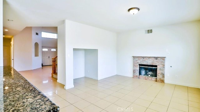 15537 Pheasant St, Chino Hills, CA 91709 - unfurnished living room featuring a premium fireplace, light tile patterned floors, and stairs