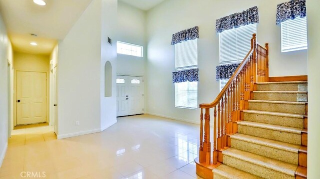 15537 Pheasant St, Chino Hills, CA 91709 - foyer with a high ceiling, healthy amount of natural light, stairway, recessed lighting, and arched walkways