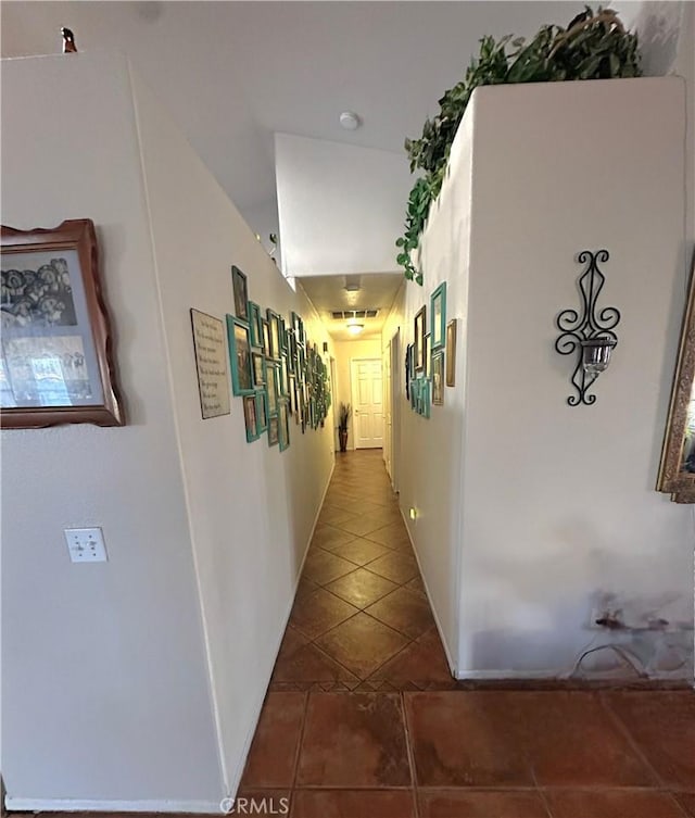 12649 Mesa Linda Ave, Victorville, CA 92392 - corridor featuring dark tile patterned flooring and baseboards