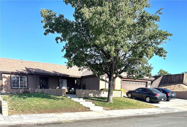 12649 Mesa Linda Ave, Victorville, CA 92392 - ranch-style house featuring an attached garage, a front yard, concrete driveway, stucco siding, and a tile roof