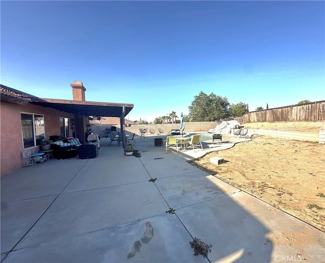 12649 Mesa Linda Ave, Victorville, CA 92392 - fenced backyard with a patio area and an outdoor hangout area