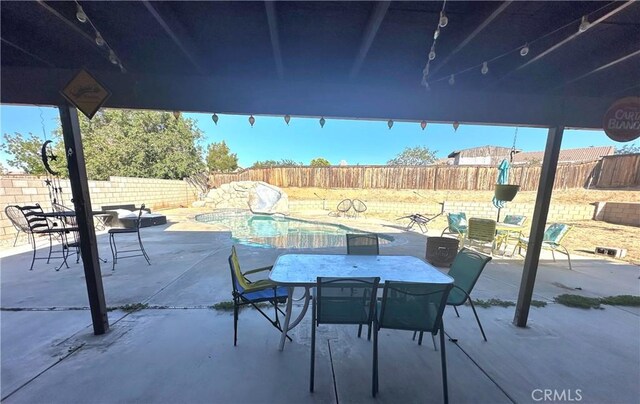 12649 Mesa Linda Ave, Victorville, CA 92392 - fenced backyard featuring a patio area and outdoor dining space