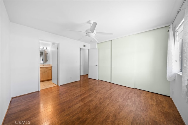 1456 Countrywood Ave Unit 14, Hacienda Heights, CA 91745 - unfurnished bedroom with wood finished floors, a closet, ceiling fan, and ensuite bathroom