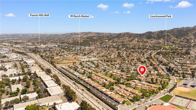 1456 Countrywood Ave Unit 14, Hacienda Heights, CA 91745 - aerial view of residential area featuring a major roadway and mountains
