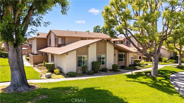1456 Countrywood Ave Unit 14, Hacienda Heights, CA 91745 - view of front facade featuring stucco siding and a front lawn