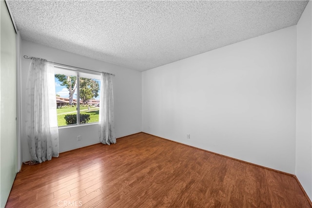 1456 Countrywood Ave Unit 14, Hacienda Heights, CA 91745 - spare room with wood finished floors and a textured ceiling