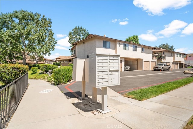 1456 Countrywood Ave Unit 14, Hacienda Heights, CA 91745 - surrounding community with mail area, a residential view, and a garage
