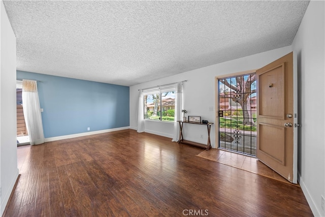 1456 Countrywood Ave Unit 14, Hacienda Heights, CA 91745 - unfurnished living room with wood finished floors and a textured ceiling