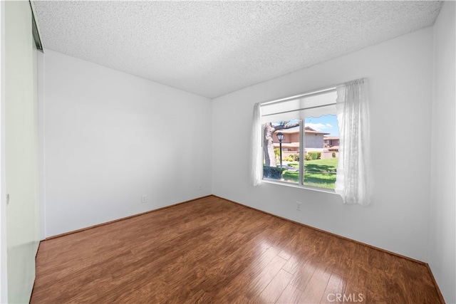 1456 Countrywood Ave Unit 14, Hacienda Heights, CA 91745 - spare room with wood finished floors and a textured ceiling
