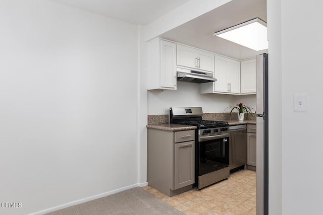 837 Magnolia Ave Unit 12, Pasadena, CA 91106 - kitchen with stainless steel appliances, under cabinet range hood, white cabinetry, dark countertops, and light floors