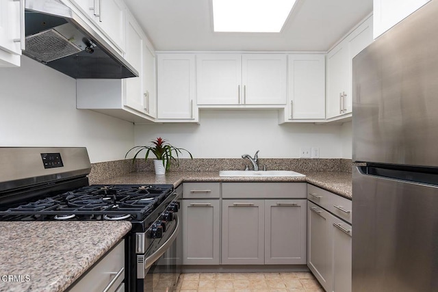 837 Magnolia Ave Unit 12, Pasadena, CA 91106 - kitchen with appliances with stainless steel finishes, under cabinet range hood, gray cabinetry, and white cabinets