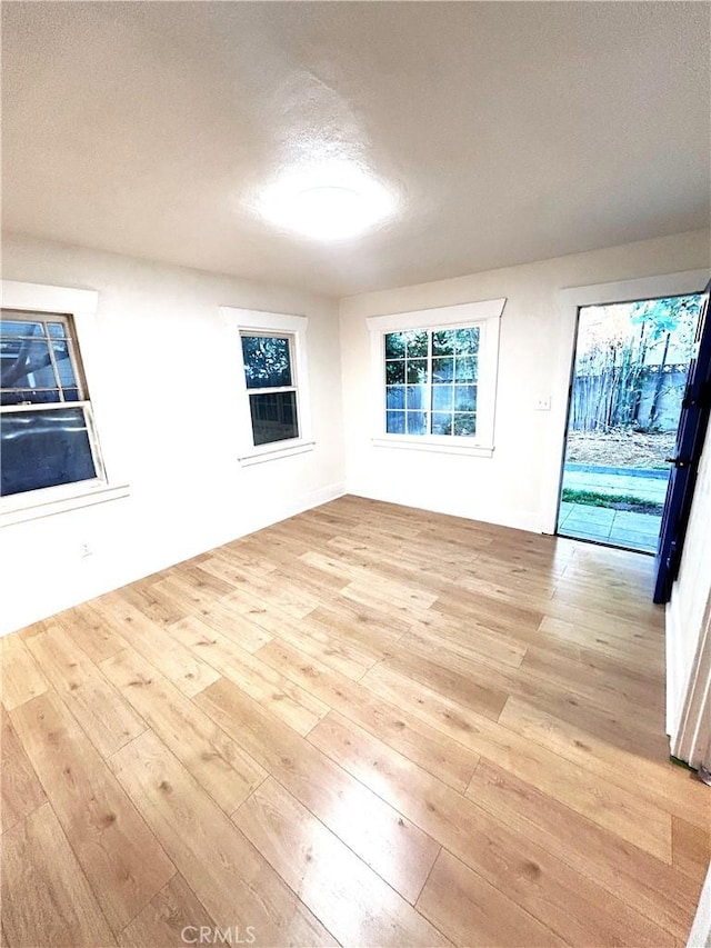 170 N Holliston Ave Unit 5, Pasadena, CA 91106 - unfurnished living room featuring hardwood / wood-style flooring and a textured ceiling