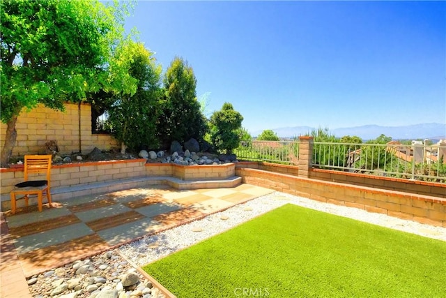 18431 Dancy St, Rowland Heights, CA 91748 - fenced backyard with a mountain view and a patio area