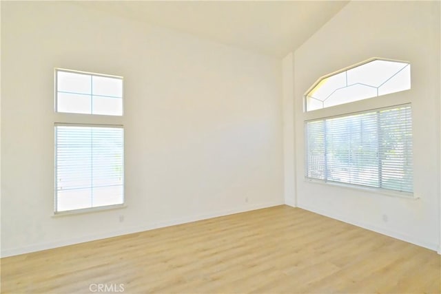 18431 Dancy St, Rowland Heights, CA 91748 - empty room featuring light wood finished floors and a high ceiling