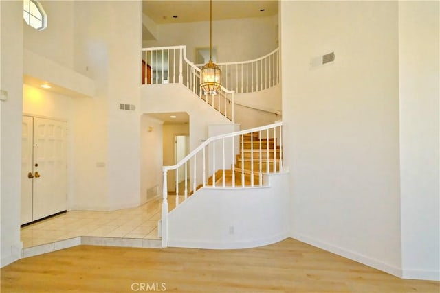 18431 Dancy St, Rowland Heights, CA 91748 - foyer entrance featuring stairway, wood finished floors, and a high ceiling