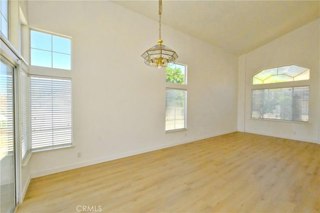 18431 Dancy St, Rowland Heights, CA 91748 - spare room featuring a chandelier, light wood-style floors, and high vaulted ceiling