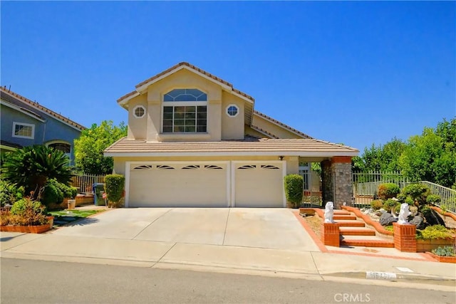 18431 Dancy St, Rowland Heights, CA 91748 - view of front of home featuring a garage, concrete driveway, a tile roof, and stucco siding