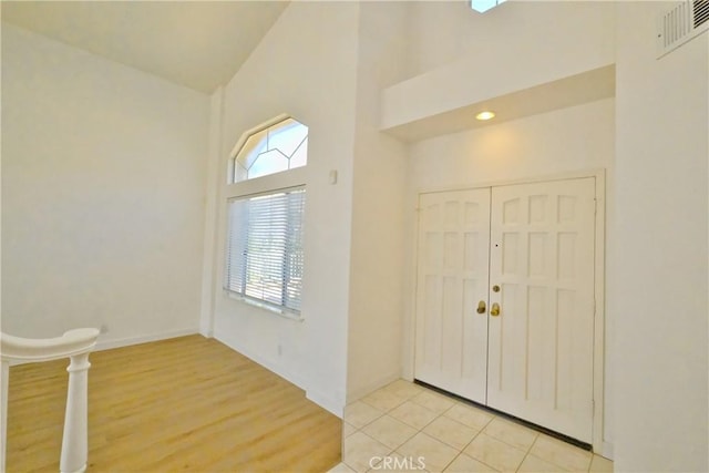 18431 Dancy St, Rowland Heights, CA 91748 - foyer featuring high vaulted ceiling, plenty of natural light, and light wood-type flooring