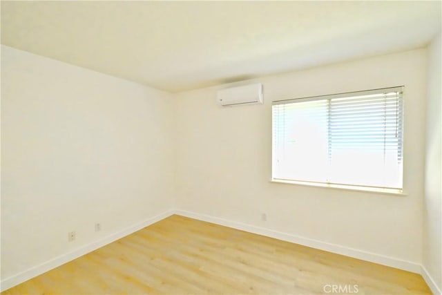 18431 Dancy St, Rowland Heights, CA 91748 - spare room featuring a wall mounted AC and light wood-type flooring