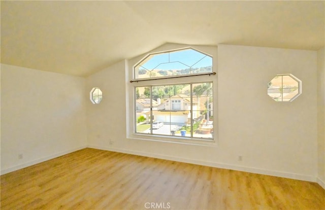 18431 Dancy St, Rowland Heights, CA 91748 - empty room with light wood-type flooring and lofted ceiling