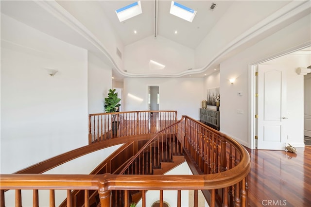 4642 Ohio St, Yorba Linda, CA 92886 - stairs featuring a skylight, wood finished floors, high vaulted ceiling, and recessed lighting