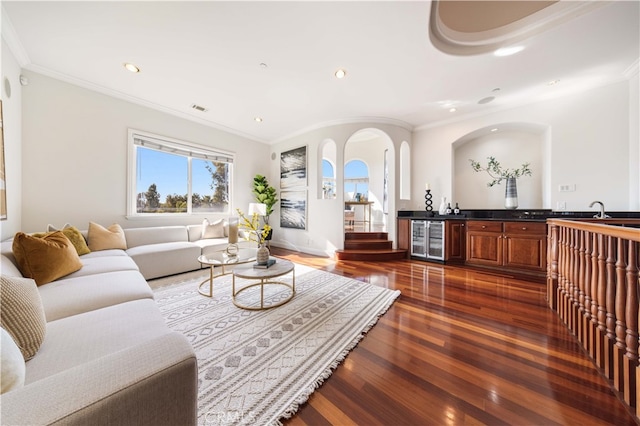 4642 Ohio St, Yorba Linda, CA 92886 - living room featuring beverage cooler, wet bar, dark wood-type flooring, recessed lighting, and crown molding