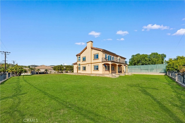 4642 Ohio St, Yorba Linda, CA 92886 - rear view of house with a balcony, a fenced backyard, stucco siding, and a chimney