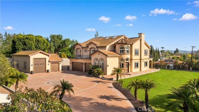 4642 Ohio St, Yorba Linda, CA 92886 - mediterranean / spanish-style house featuring stucco siding, driveway, a garage, a front lawn, and a chimney