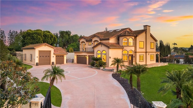 4642 Ohio St, Yorba Linda, CA 92886 - view of front of home with concrete driveway, stucco siding, a balcony, and a chimney