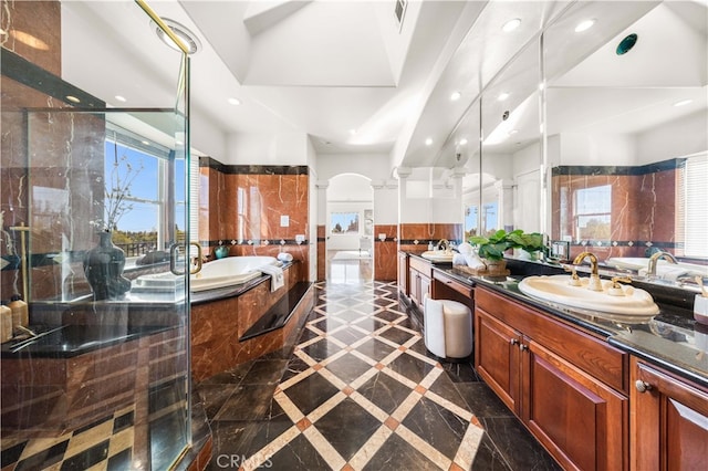 4642 Ohio St, Yorba Linda, CA 92886 - bathroom with inlaid floor details, a garden tub, double vanity, recessed lighting, and wainscoting