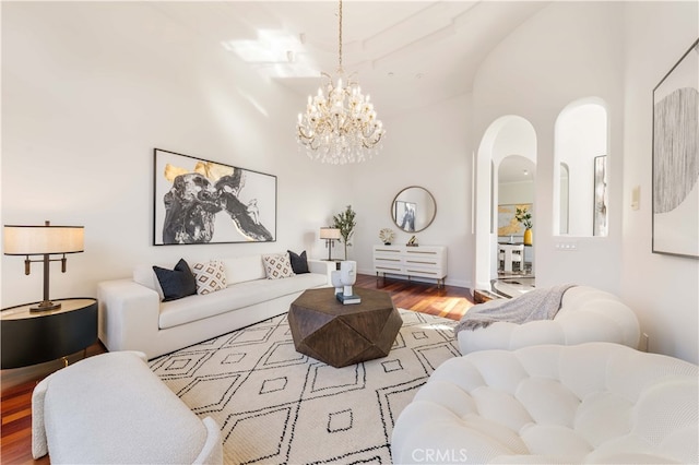 4642 Ohio St, Yorba Linda, CA 92886 - living area with arched walkways, wood finished floors, a chandelier, and a towering ceiling